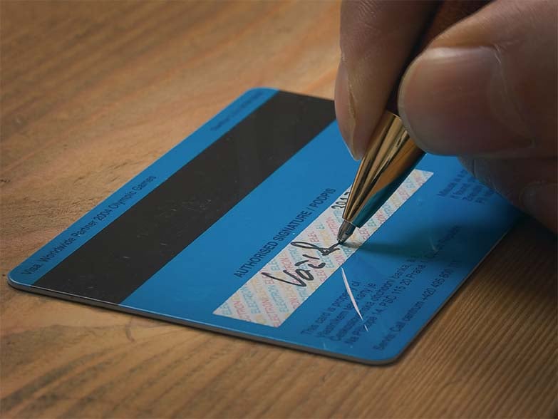 What is the best way to sign a credit card?