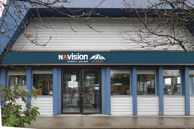 Photo of the Juneau branch's exterior in Juneau, AK with a dark blue, white, and orange reading Nuvision Credit Union Alaska complete with a mountain decal